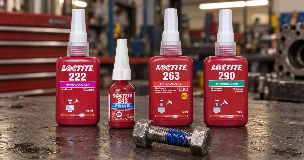 Four Loctite threadlocker bottles — 222 purple, 243 blue, 263 red and 290 green — standing on a workshop bench beside a hex head bolt with vivid blue threadlocker applied to the threads