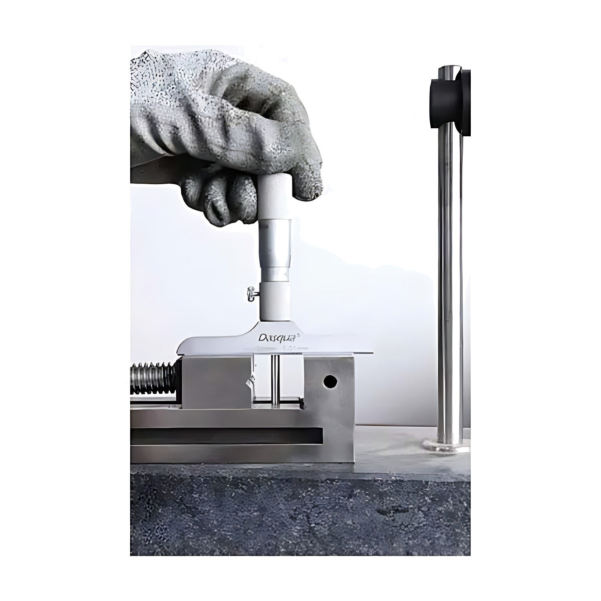Dasqua Depth Micrometer in use, gloved hand holding it on a workpiece in a vice