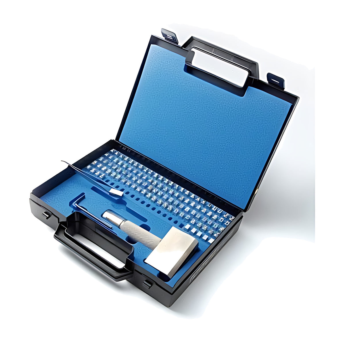 Gravurem type-in font stamp set open in a black carry case, rows of type, tweezers and holder in a foam insert