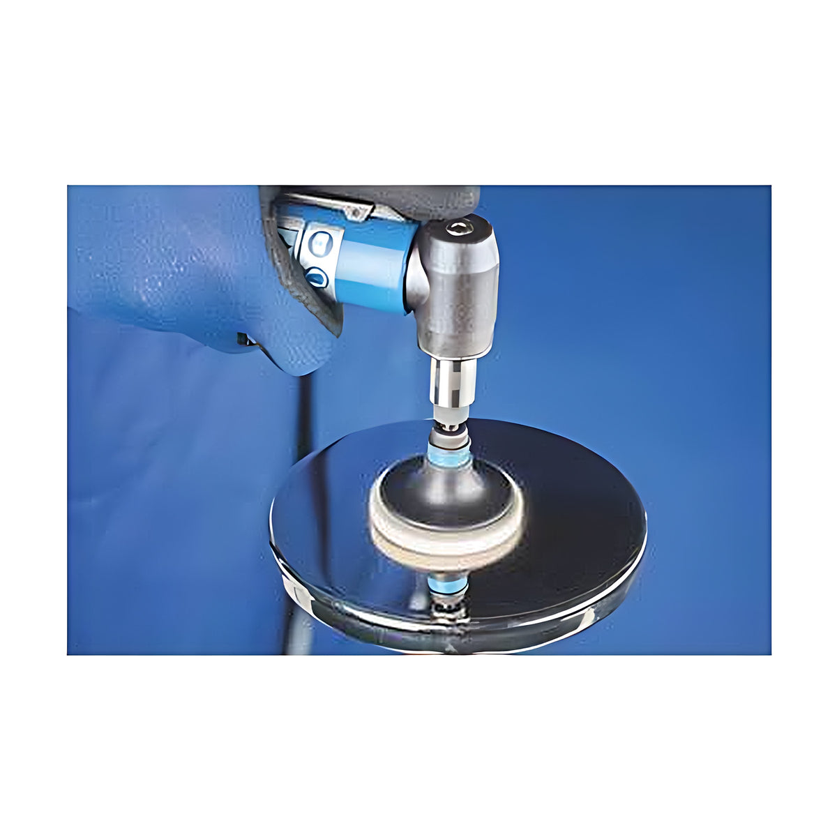 Pferd Combidisc CDR FR felt disc on an air tool, blue-gloved operator polishing a mirror-finish round steel plate