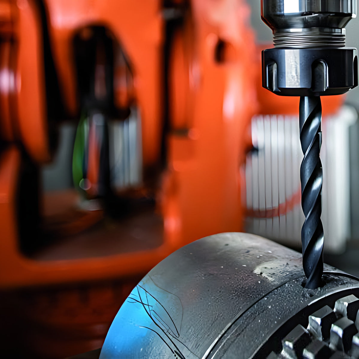 Pferd 8-piece 3 to 8 mm HSSG N Steel twist drill in use, wide crop of an orange drilling machine and the bit