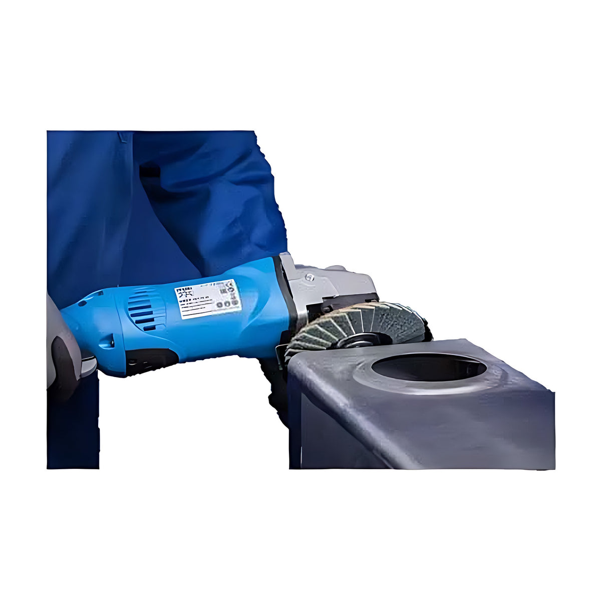 Pferd POLIVLIES PVZ Flap Disc, Ceramic Oxide Grain, blue angle grinder with a flap disc working the edge of a dark steel box section, operator in blue overalls