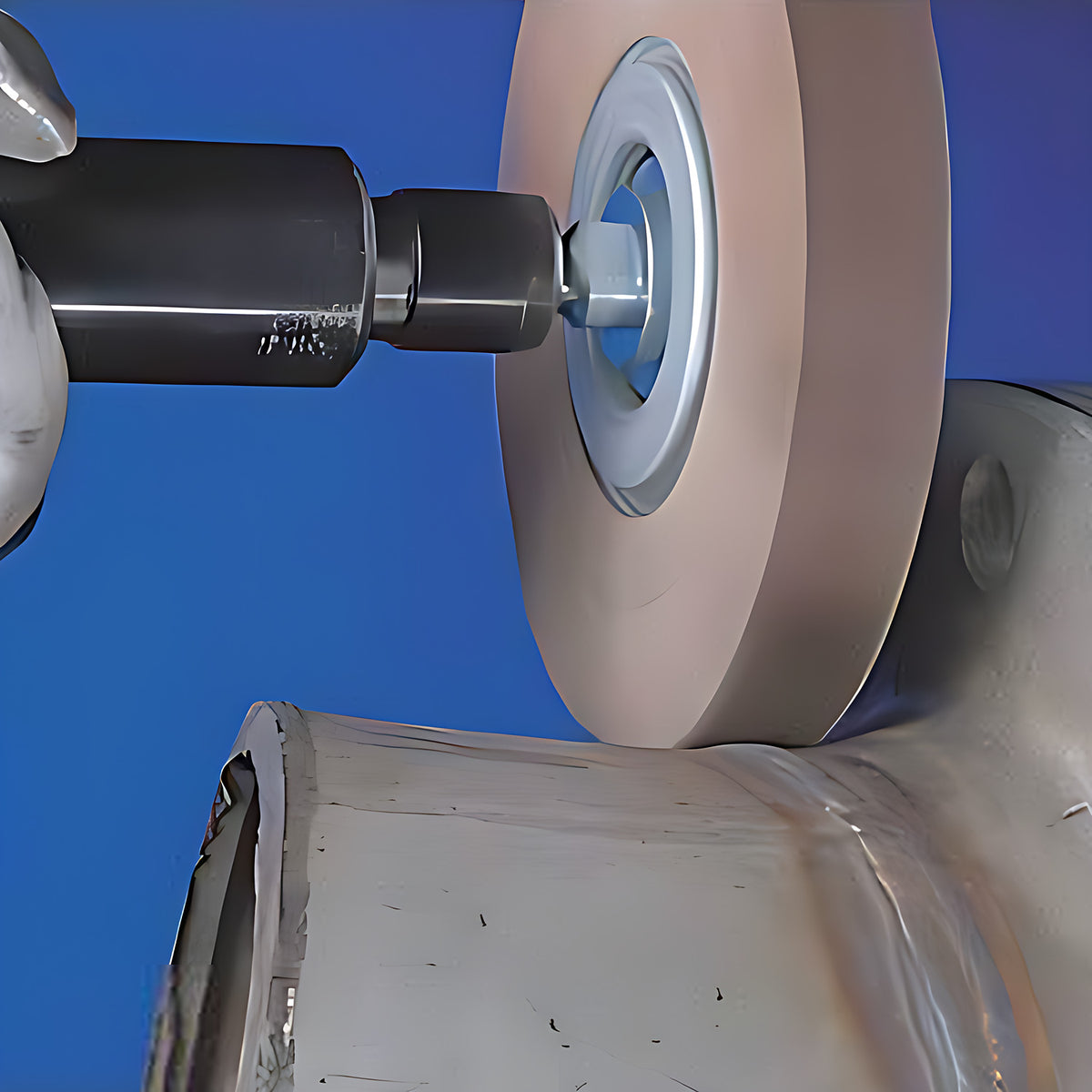 Pferd FR Unmounted Flap Wheel, Aluminium Oxide, 100 x, flap wheel on a spindle with a hex adaptor smoothing the inside of a steel pipe flange, blue background