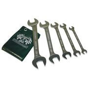 Five Stahlwille double open-ended spanners in graduated sizes beside a green pouch with a chequered flag print